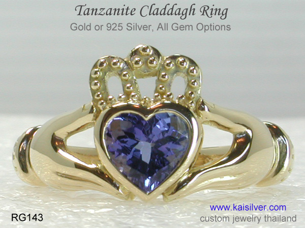 gold claddagh ring with gemstone
